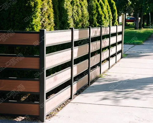 Modern non-privacy composite wood-like fence with thujas for natural protection