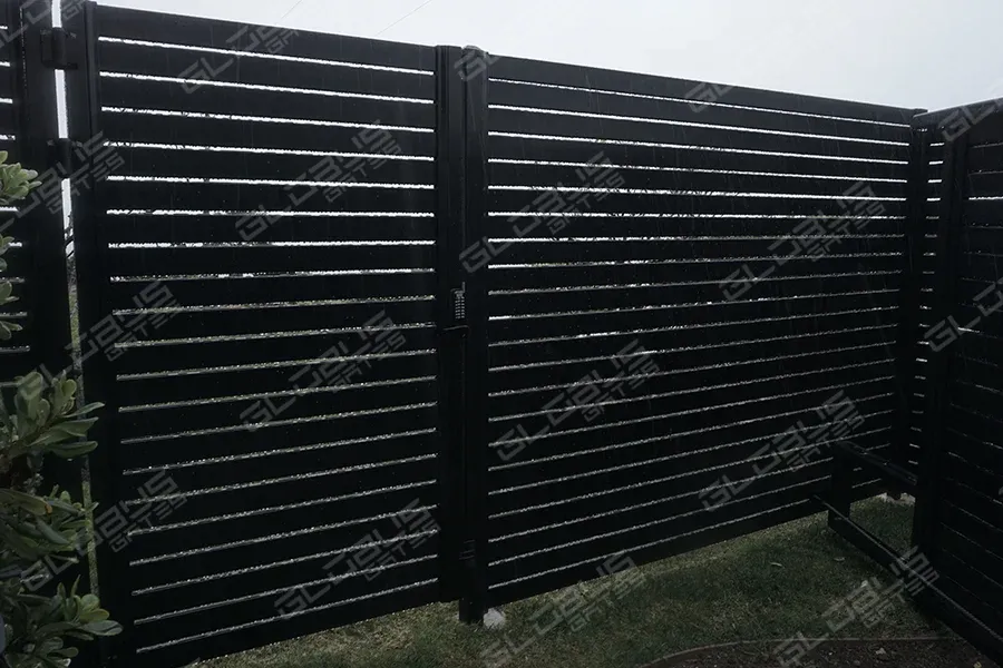 Black vinyl fence on a beach home showcasing durability against salt-air and corrosion