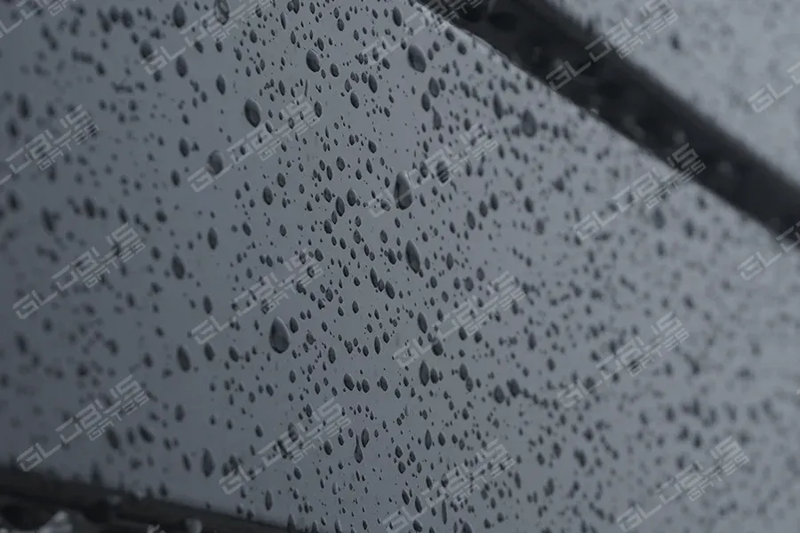 Close-up view of rain droplets on a durable fence designed for coastal areas