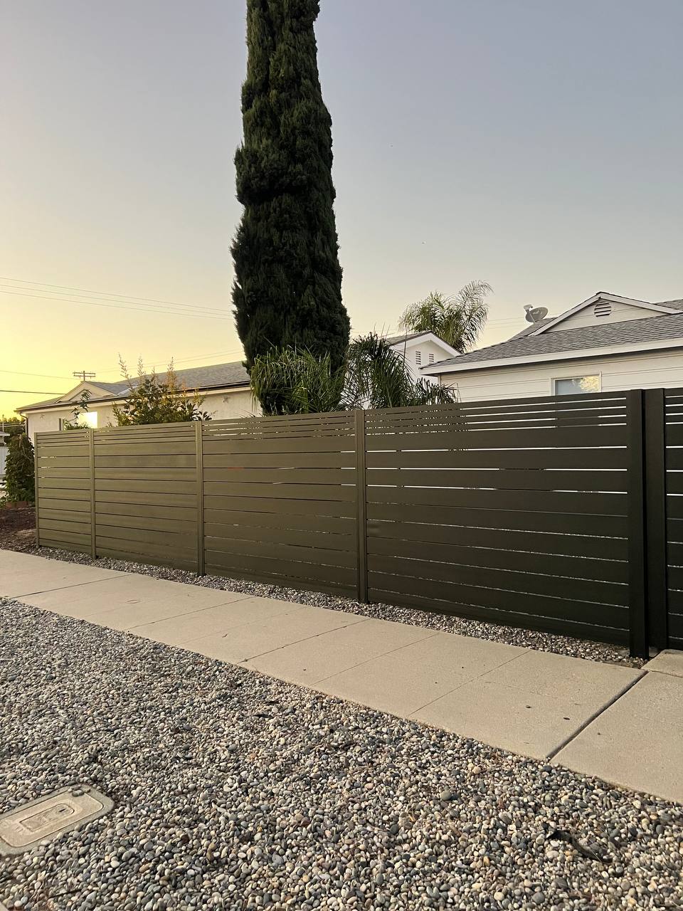 Installing slimline fence on sloped Austin lot