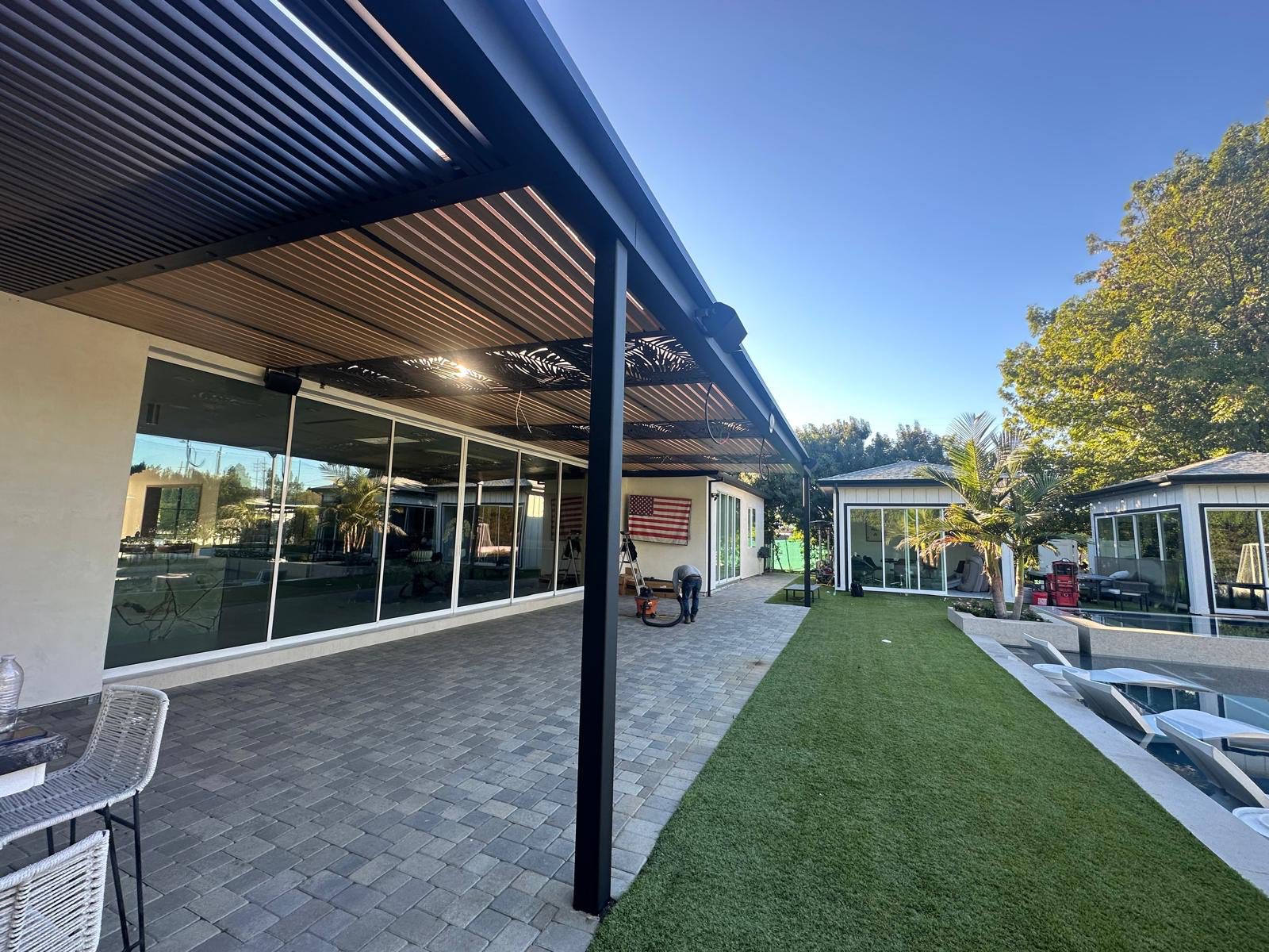 Details that make a pergola feel custom (lighting, drainage, and built-ins)