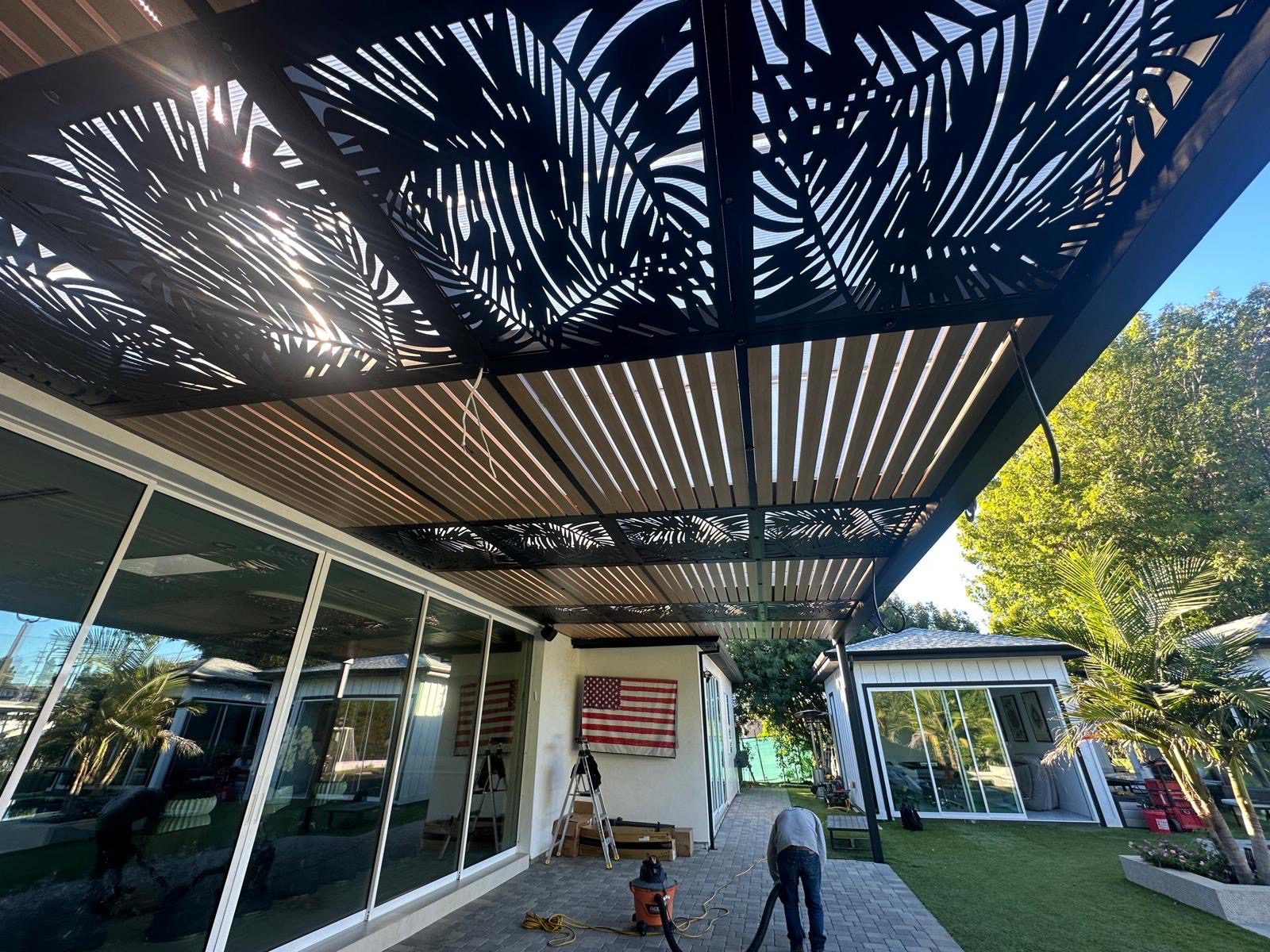 Laser-cut pergola roof casting decorative shadows