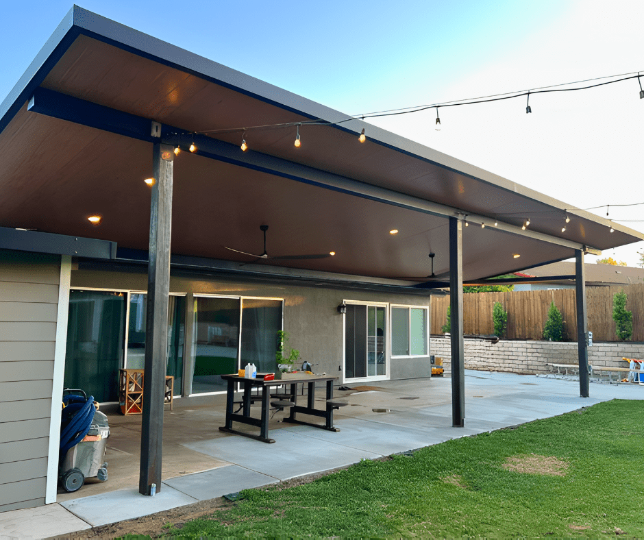 Solid insulated pergola roof over outdoor kitchen