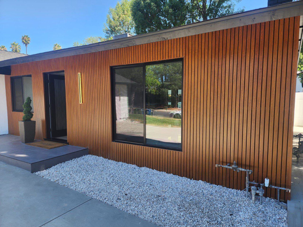 Coordinating cladding with gates, fencing, and exterior metals