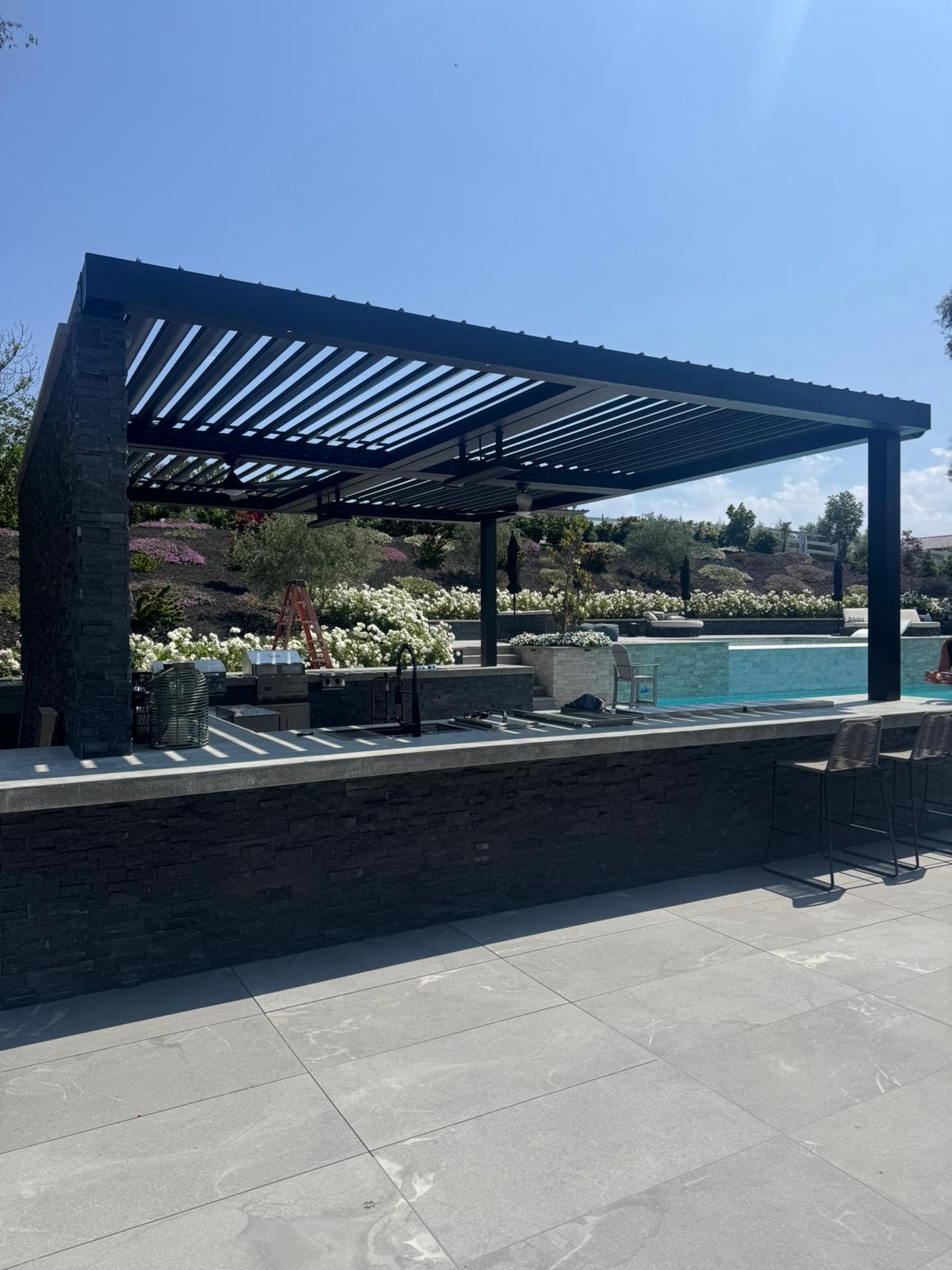 Louvered pergola installation