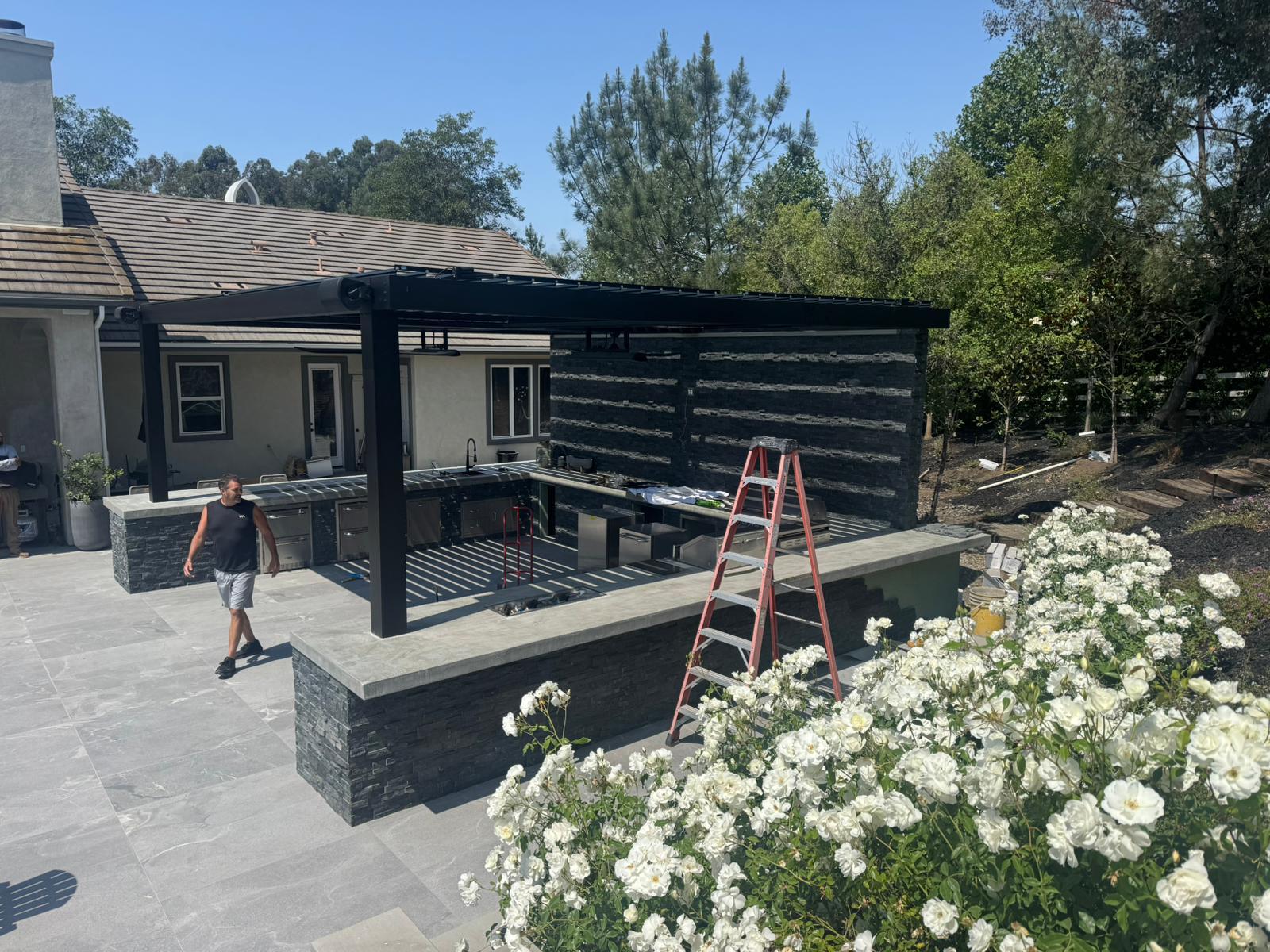 Louvered pergola installation