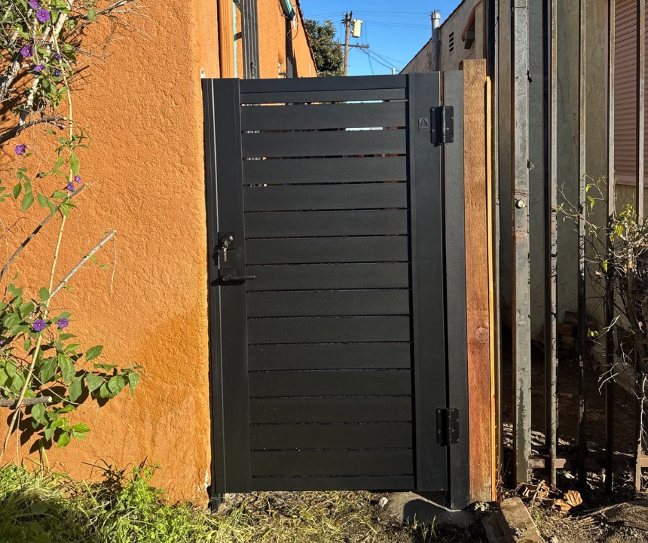 Profile 40 aluminum gate with wide vertical slats for modern residential driveway