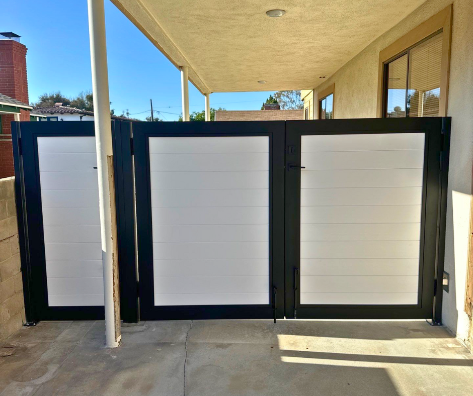 Vinyl profile gate with aluminum frame for low-maintenance modern garden entrance