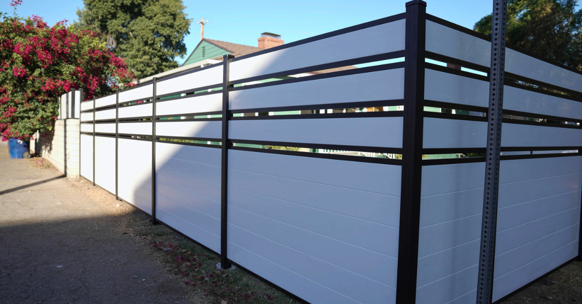 White vinyl fence panel with classic picket design for residential garden boundary