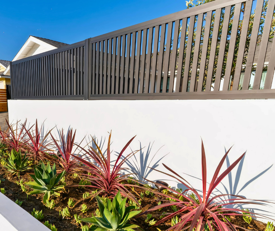 Powder-coated Profile 20 aluminum fence installed along residential driveway