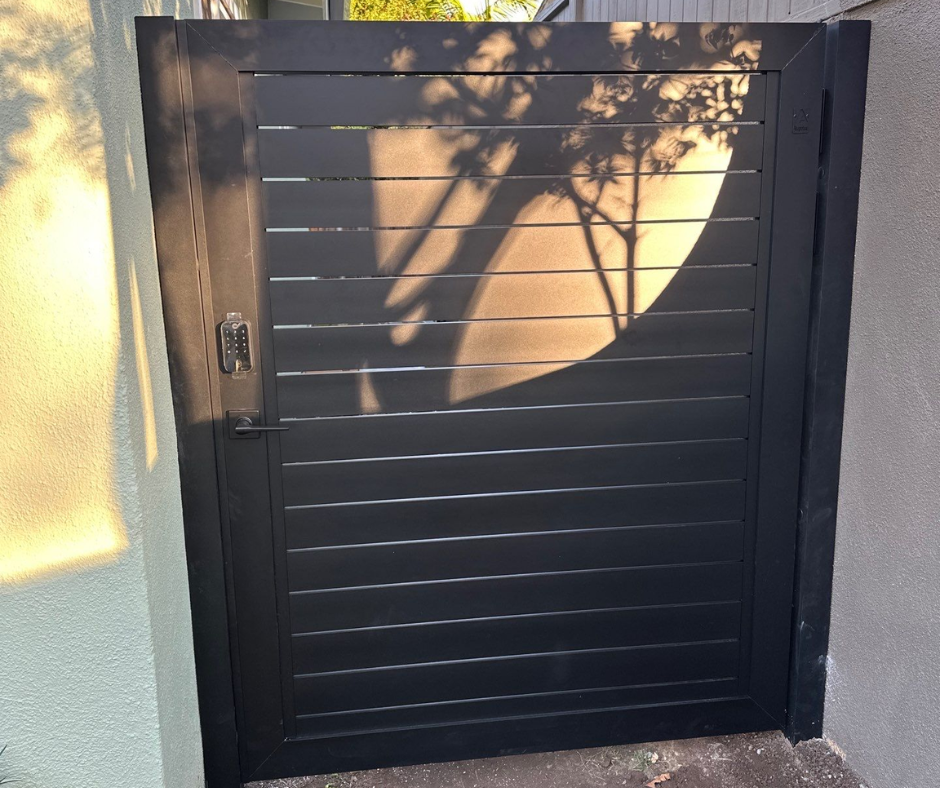 Profile 40 aluminum double gate installed at contemporary home entrance