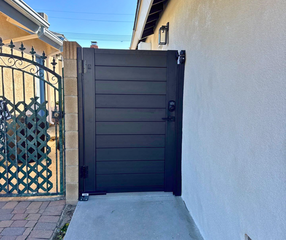 Profile 50-60 T&G aluminum double gate installed at contemporary residential driveway