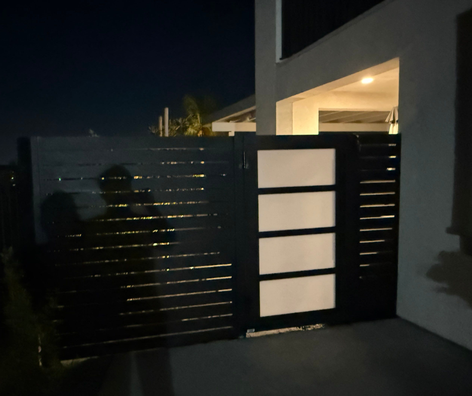 Frosted plexiglass aluminum gate providing semi-private garden entrance