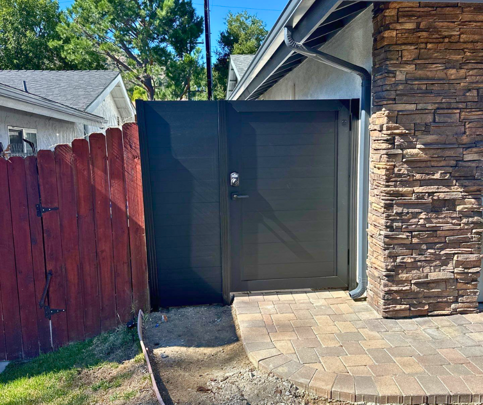 Full-height Profile 50-60 T&G aluminum gate providing complete boundary privacy