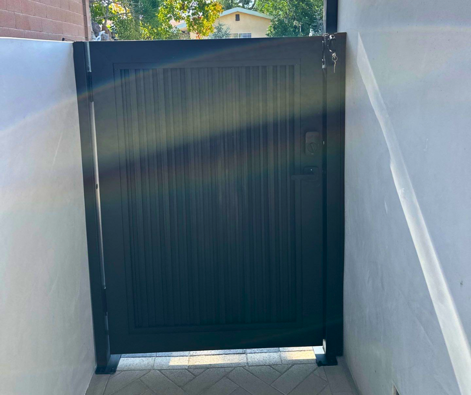 Aluminum cladding gate with architectural facade panel for modern property entrance