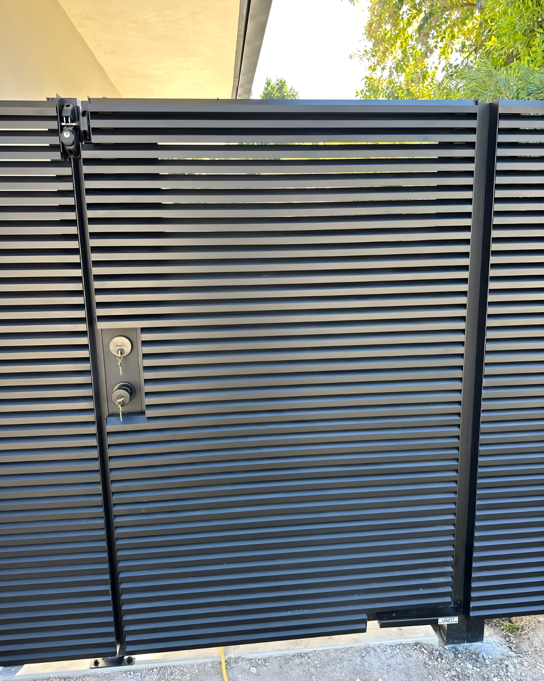 Fully assembled AeroLouver aluminum gate with powder-coated finish for outdoor use