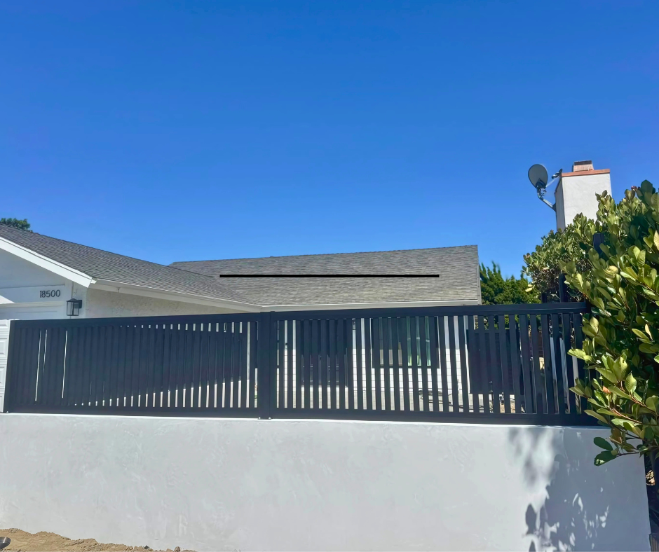 Modern aluminum wall topper with sleek profile installed on top of boundary wall