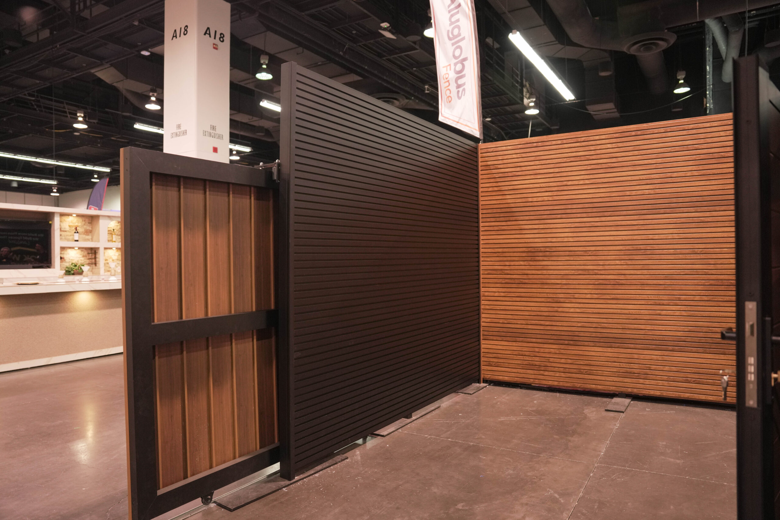 Professional installation of aluminum T&G wall cladding on modern residential building