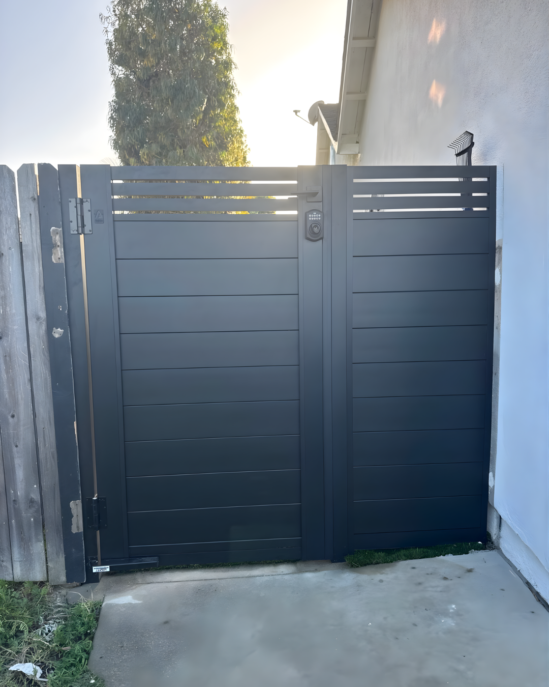Easy-install aluminum driveway gate with matching fence panel design