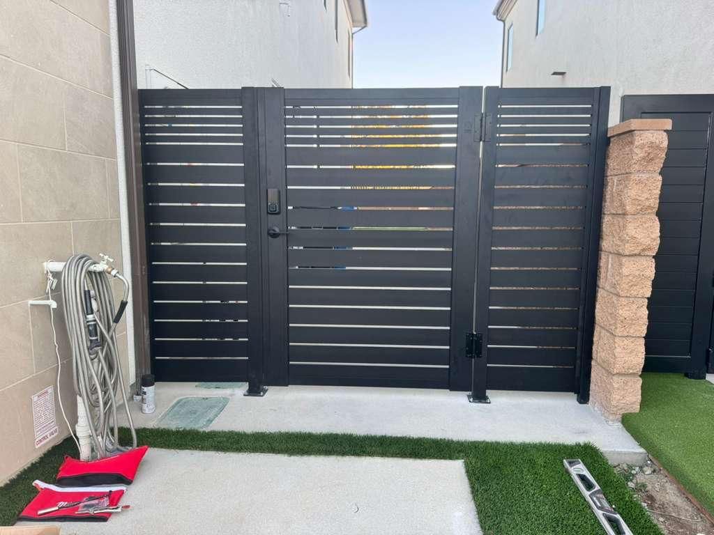 Profile 20 aluminum gate with slim vertical slats and white powder-coat finish