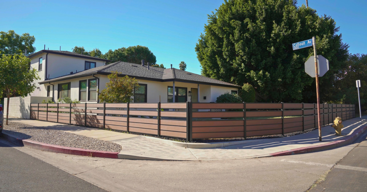 Composite fence installed on modern residential property