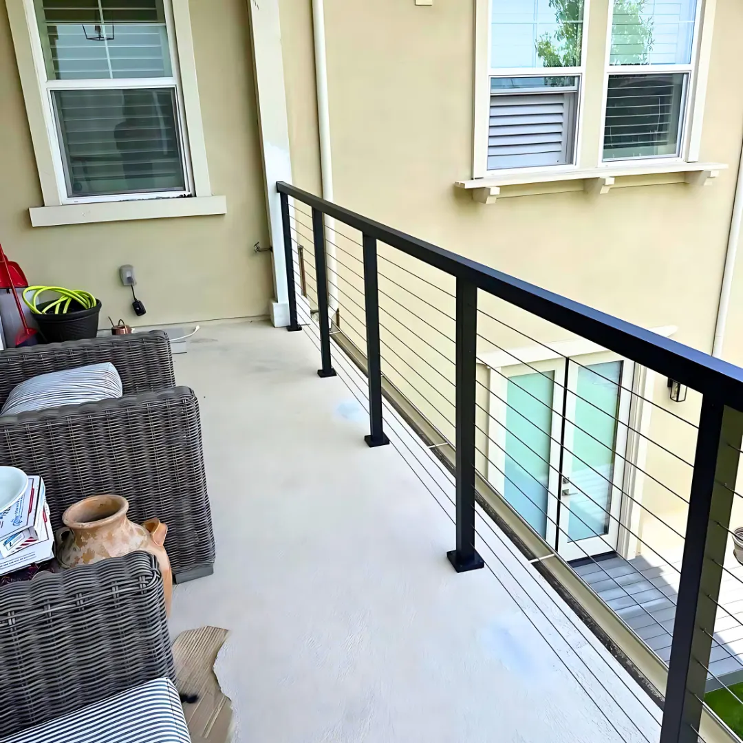Cable railing with black posts on balcony